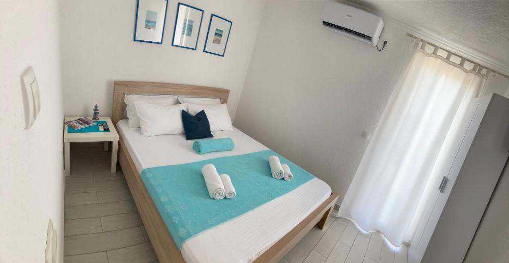 Letto o letti in una camera di ORA apartments