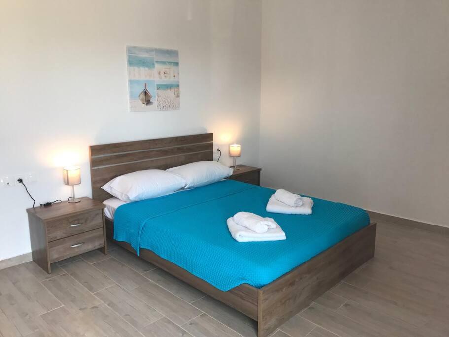 Postel nebo postele na pokoji v ubytování Karpadise Villa
