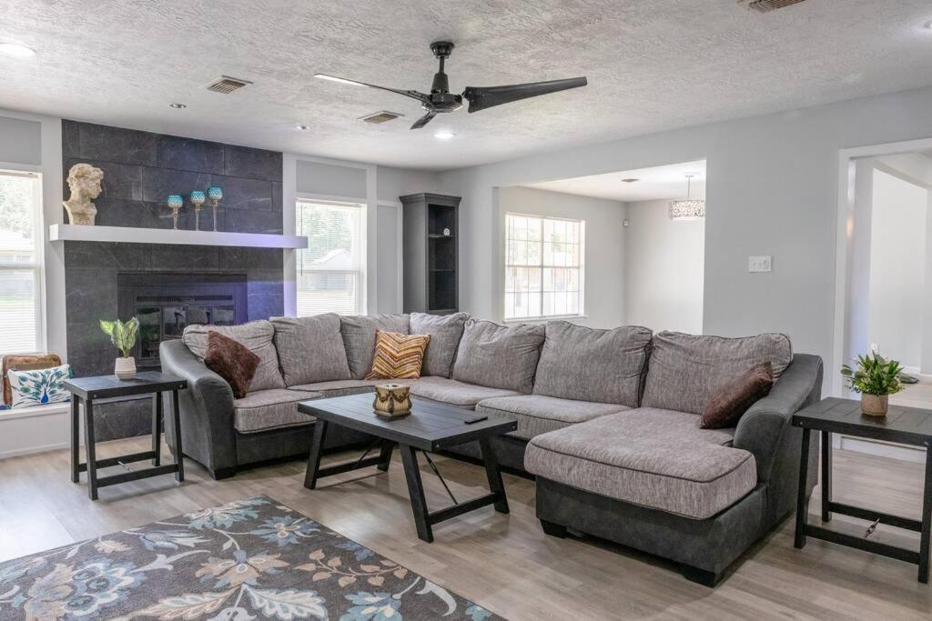 a living room with a couch and a fireplace at Clark House Perfect for Workers! in Orange