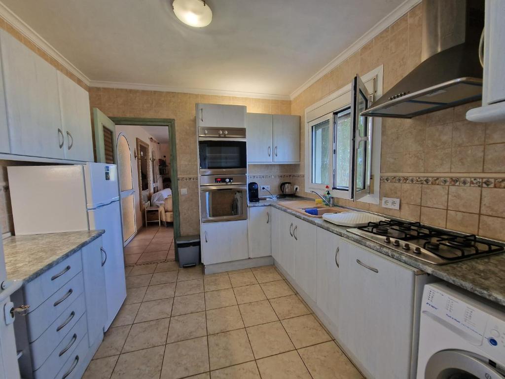 A kitchen or kitchenette at Villa Aurica