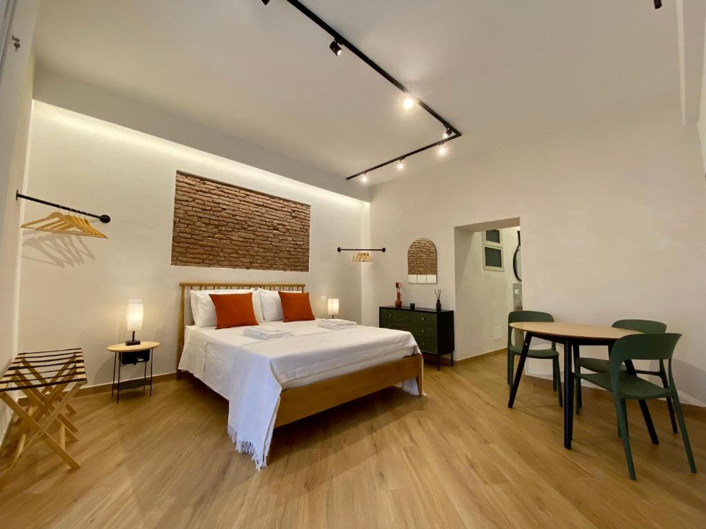 En eller flere senge i et værelse på Galatola Suite