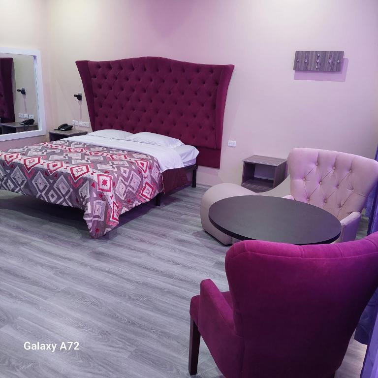 Postel nebo postele na pokoji v ubytování Hostal Kapital II