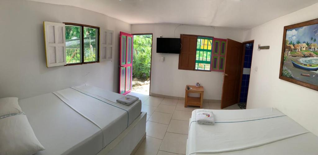 Postel nebo postele na pokoji v ubytování Hotel Agroturistico Palma Vino