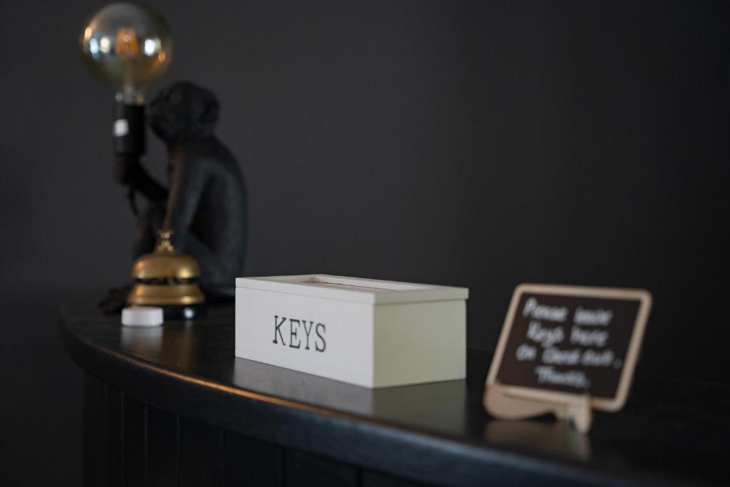 a table with a box and a sign on it at The Briers Country House in Newcastle