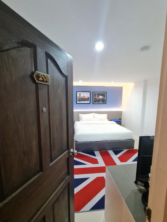 Postel nebo postele na pokoji v ubytování Poonsuk Place Hotel