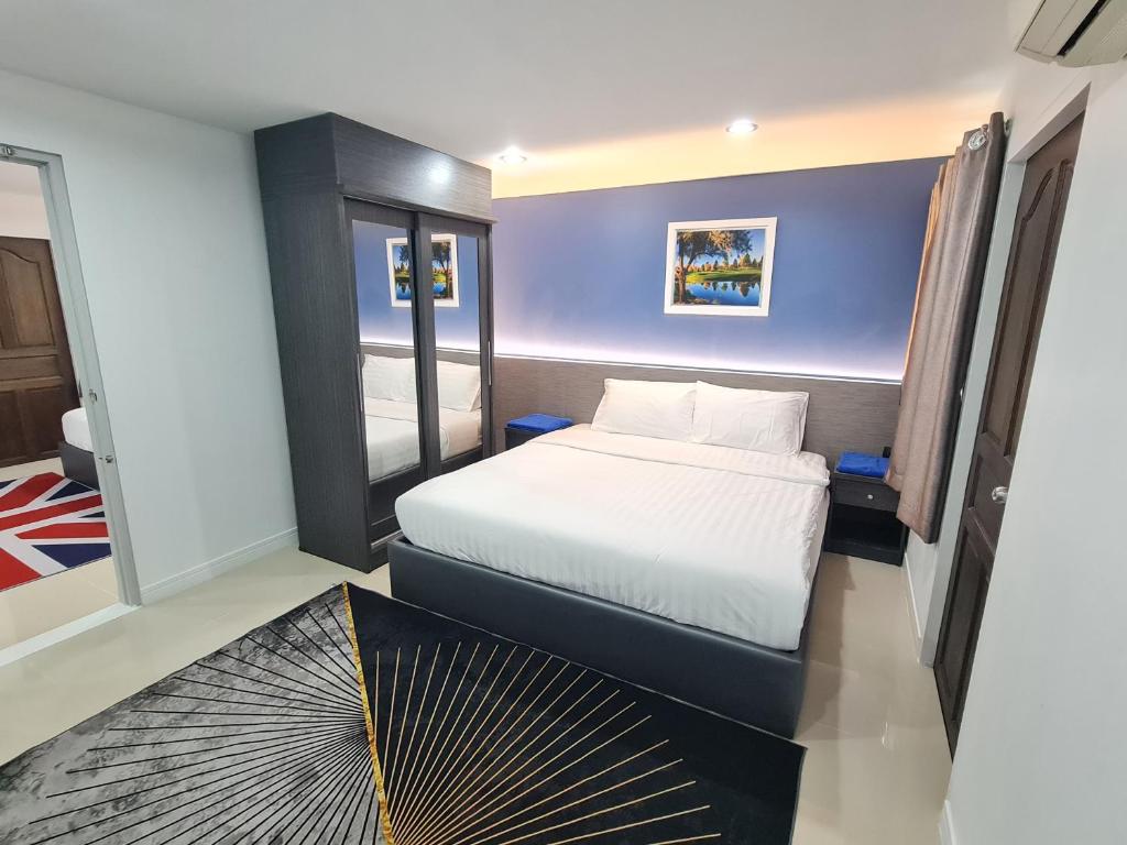 Postel nebo postele na pokoji v ubytování Poonsuk Place Hotel