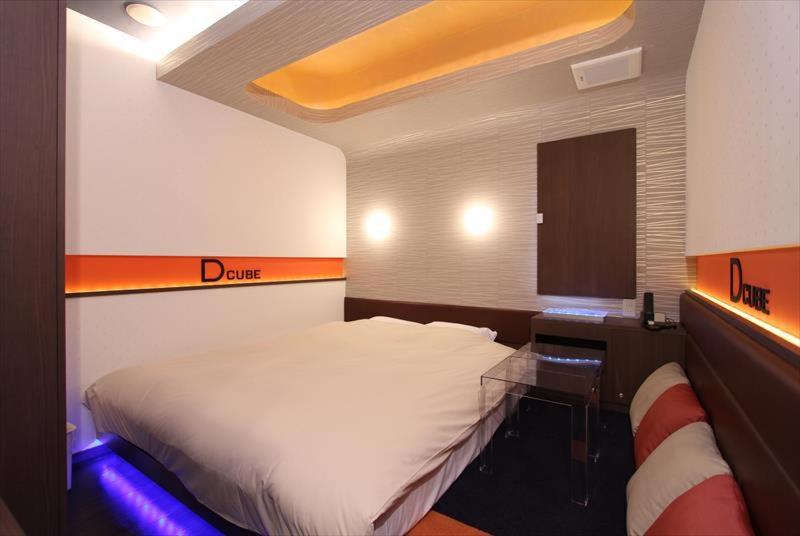 Postel nebo postele na pokoji v ubytování HOTEL DCUBE