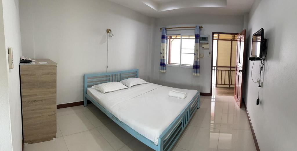 Postel nebo postele na pokoji v ubytování Pudsadee Hotel