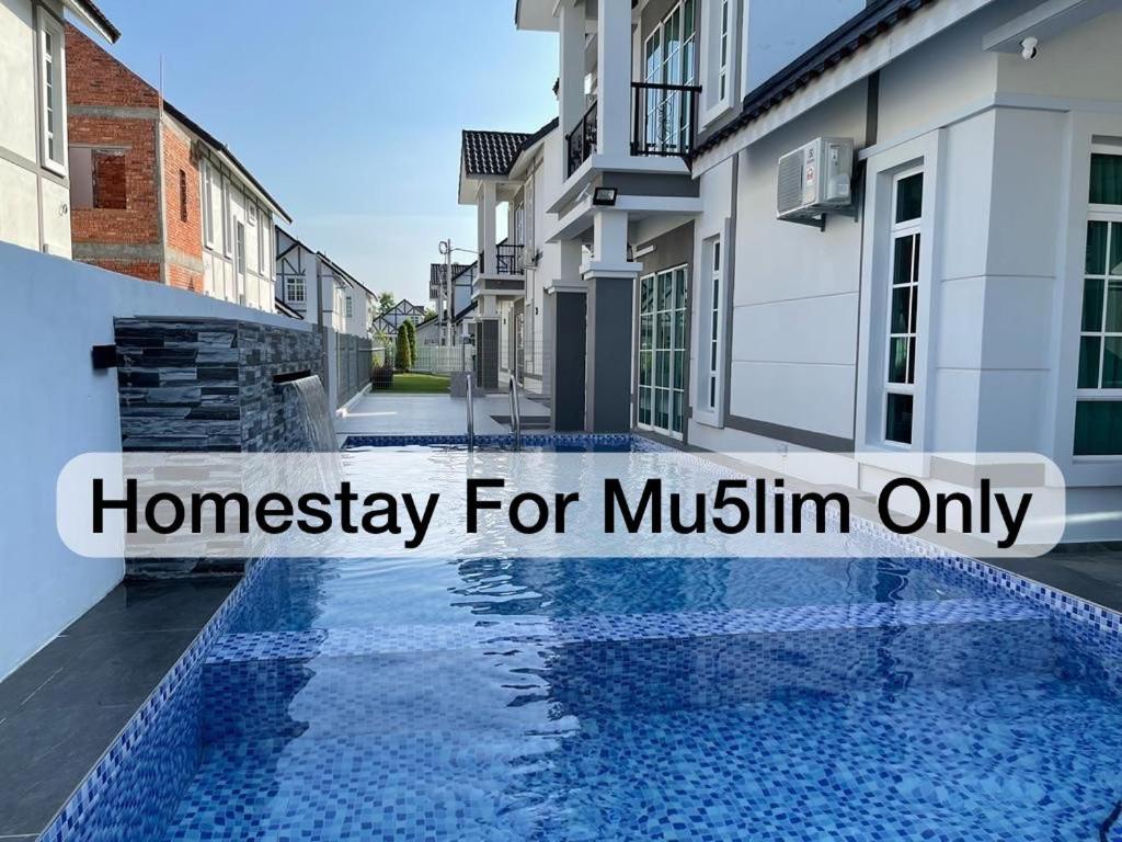 a house with a swimming pool with text overlay honeyvisor for muslin only at De France Pool Villa Mu5lim Only in Malacca