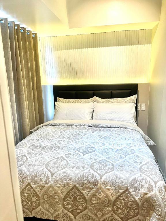 Voodi või voodid majutusasutuse E & T Homecations 2 Bedroom Apartment at SMDC Air Residences toas