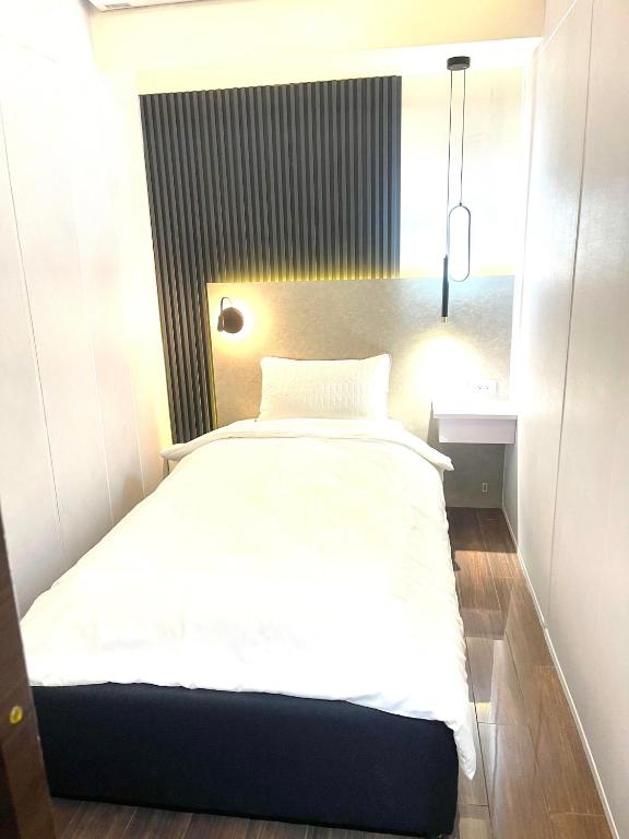 Voodi või voodid majutusasutuse E & T Homecations 2 Bedroom Apartment at SMDC Air Residences toas
