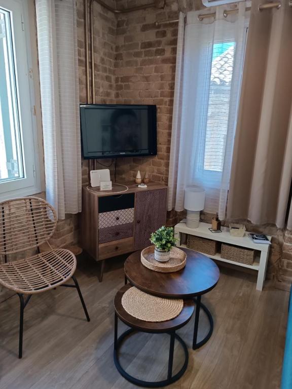 Televízia a/alebo spoločenská miestnosť v ubytovaní Casa Collage