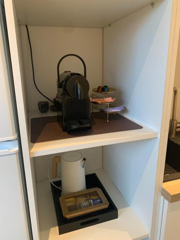 Kuchyň nebo kuchyňský kout v ubytování Q Guesthouse