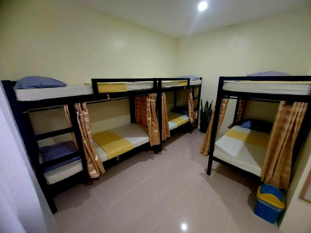Postel nebo postele na pokoji v ubytování CheRi Backpackers Hostel