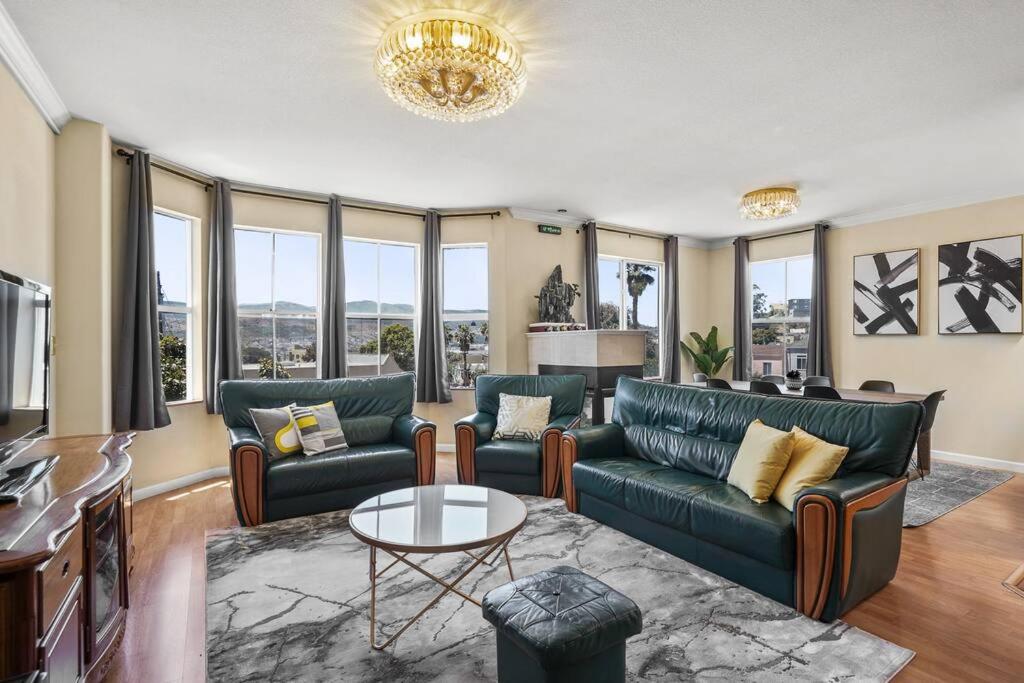 a living room with a couch and a table at Beautiful Spacious House 2BR / 4BR in Silver Terrace in San Francisco