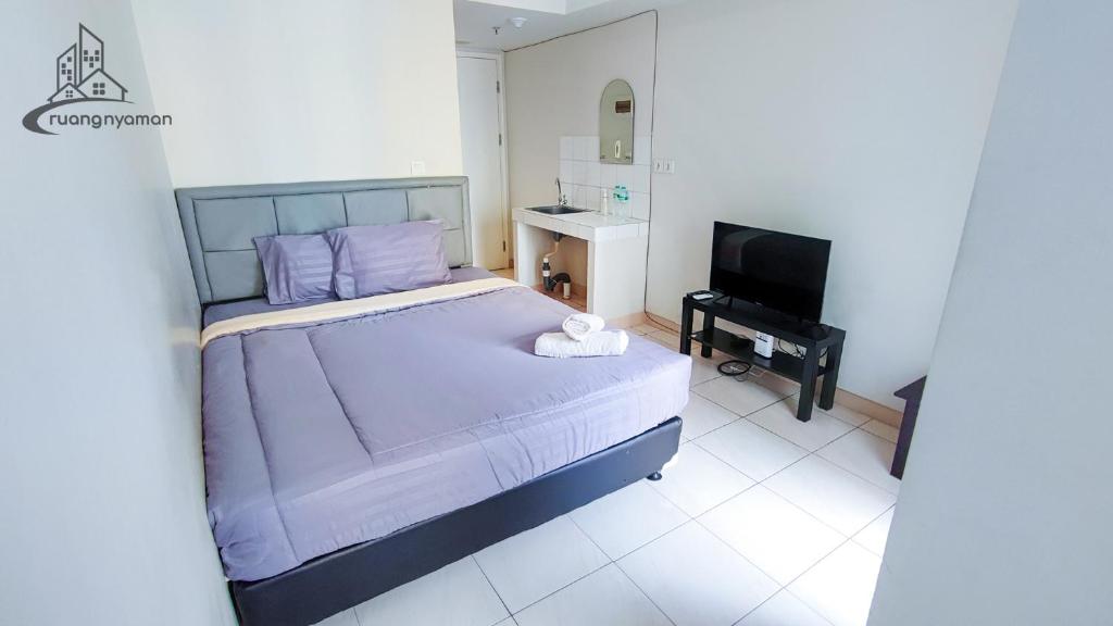 TV a/nebo společenská místnost v ubytování Springlake Summarecon Bekasi Apartement by RNA