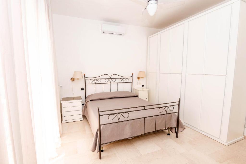Postel nebo postele na pokoji v ubytování Sosandra Rooms