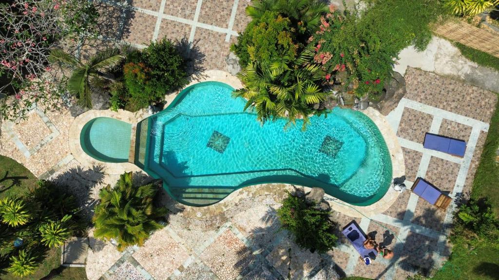 an overhead view of a swimming pool in a resort at Matahari Inn Kuta Lombok in Kuta Lombok