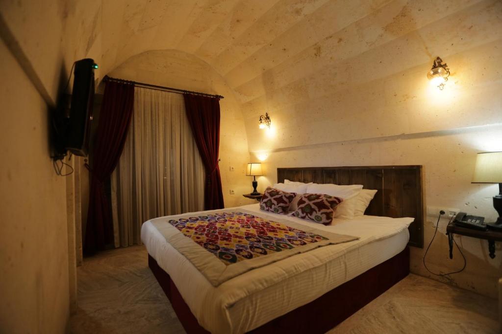 Postel nebo postele na pokoji v ubytování Corner İn Cappadocia
