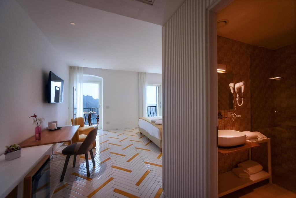 Postel nebo postele na pokoji v ubytování Hotel Graal