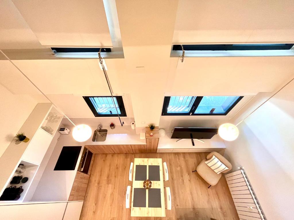 an overhead view of the living room of a house at The Ventas Whim. in Madrid