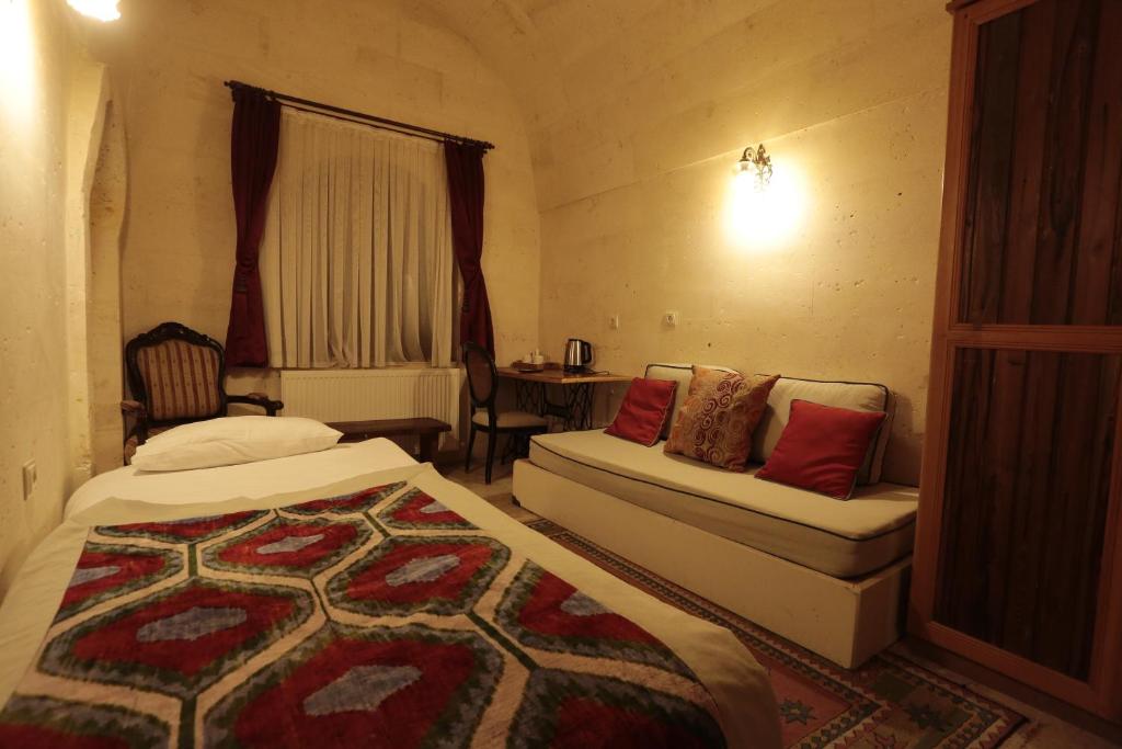 Postel nebo postele na pokoji v ubytování Corner İn Cappadocia