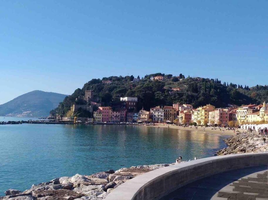 a view of a beach with buildings on a hill at Shelley’s Home in Lerici
