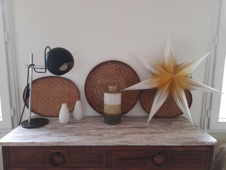 a wooden table with a star decoration on top of it at Au cabanon de Lisle in Lisle-sur-Tarn