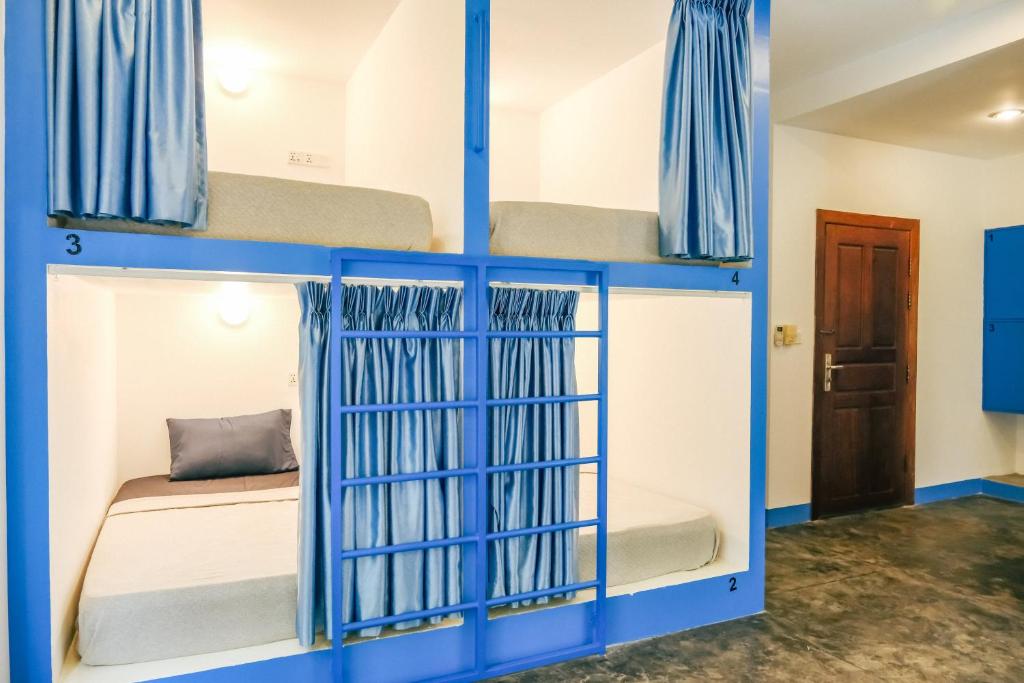Postel nebo postele na pokoji v ubytování Queentown Hostel
