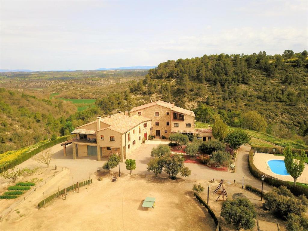 an aerial view of a house with a pool at Cal Ros in Calonge de Segarra