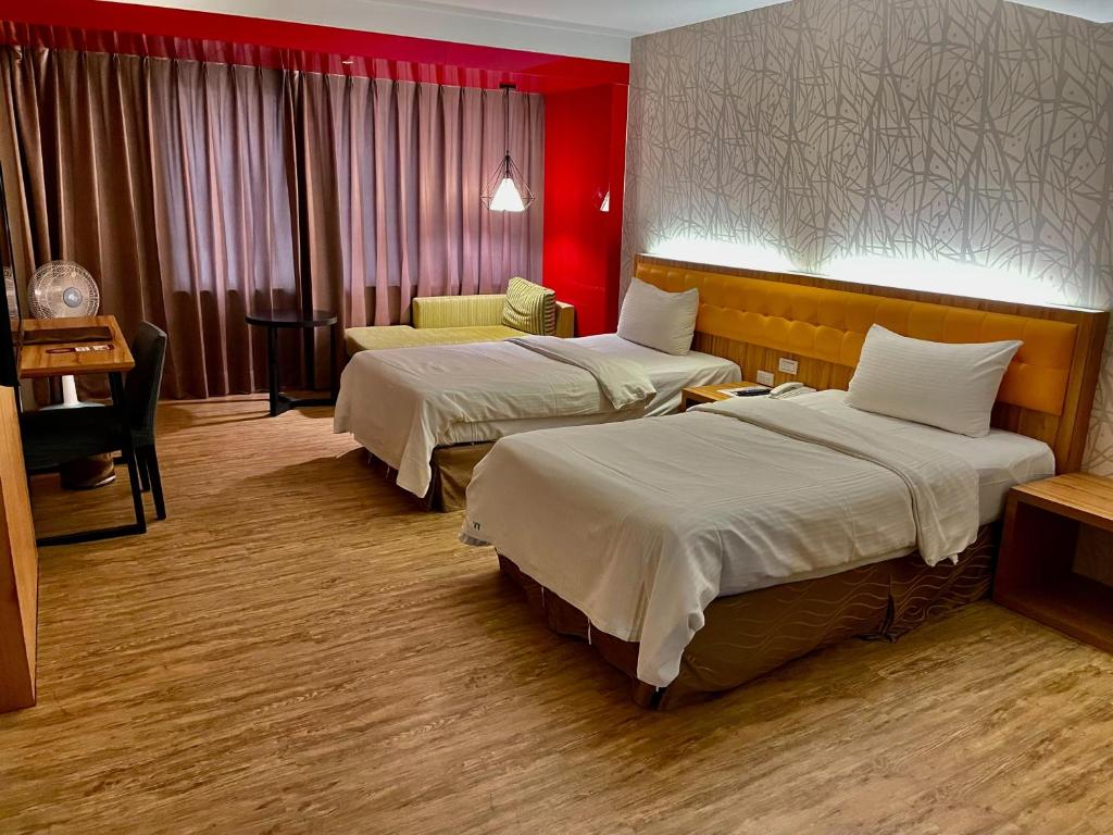 Postel nebo postele na pokoji v ubytování Bamboo Hotel