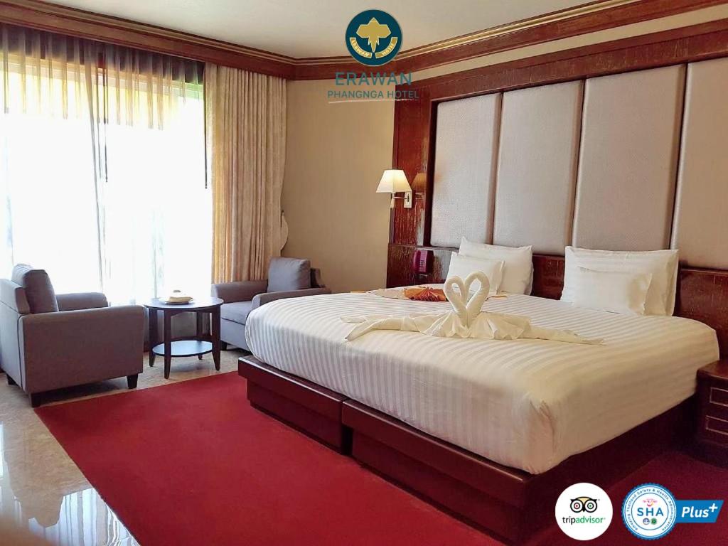 Postel nebo postele na pokoji v ubytování Erawan Hotel