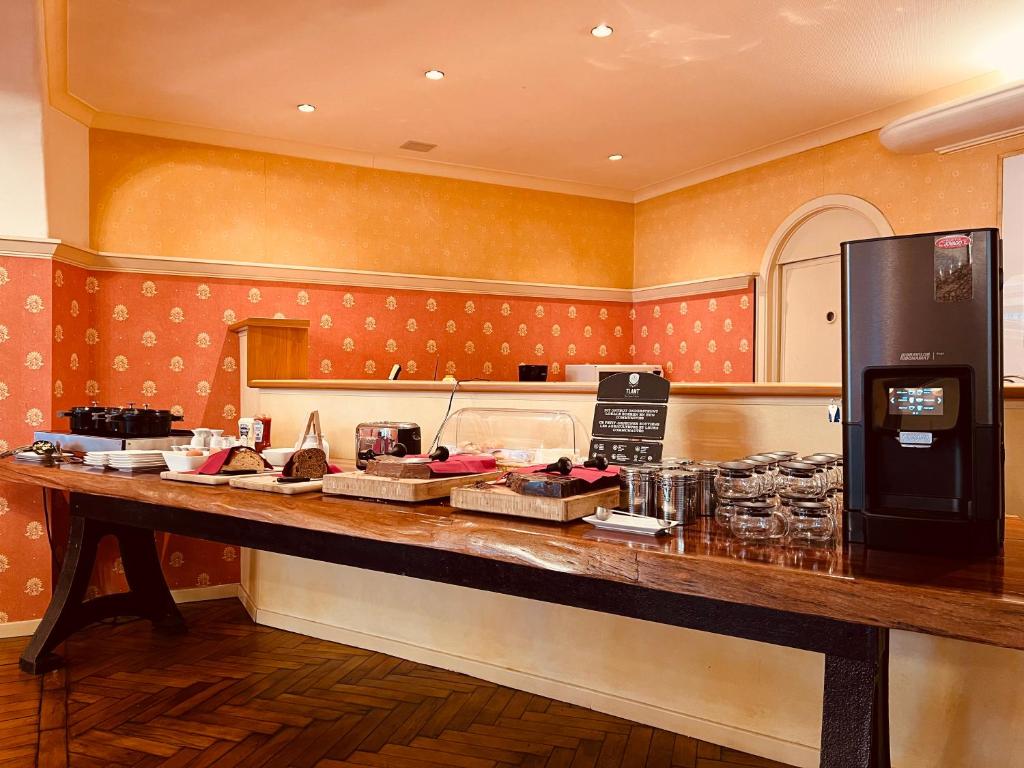 Kuchyň nebo kuchyňský kout v ubytování Avenue Hotel by F-Hotels