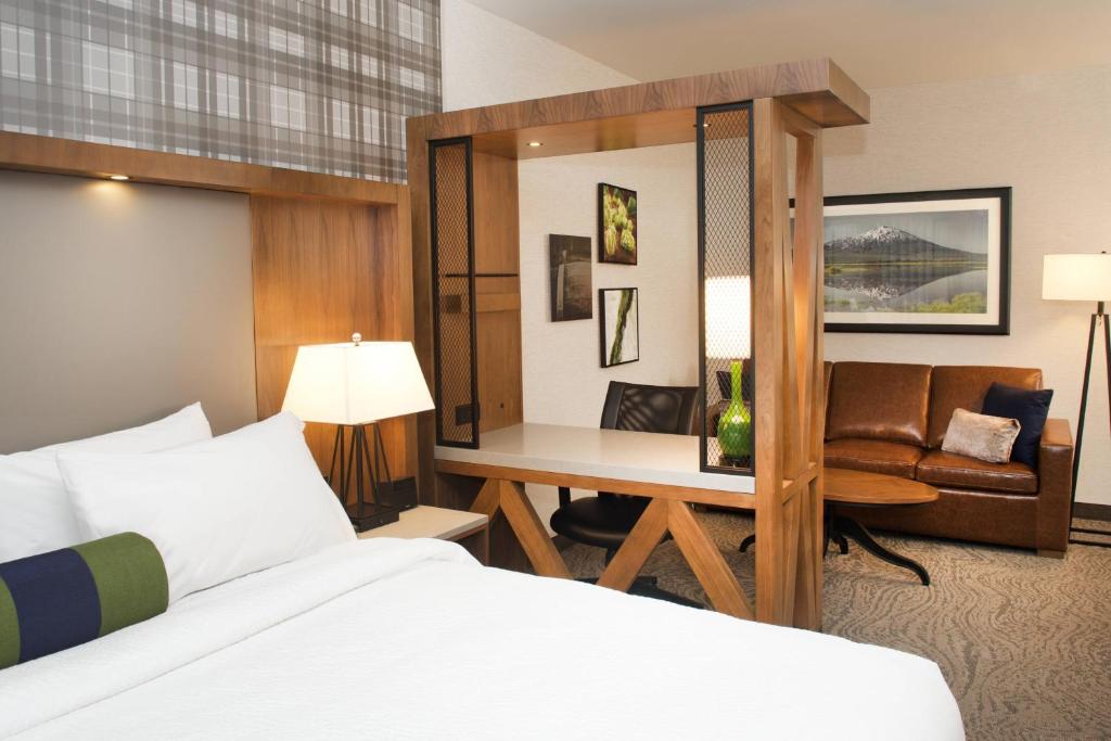 a hotel room with a bed and a desk at SpringHill Suites by Marriott Bend in Bend