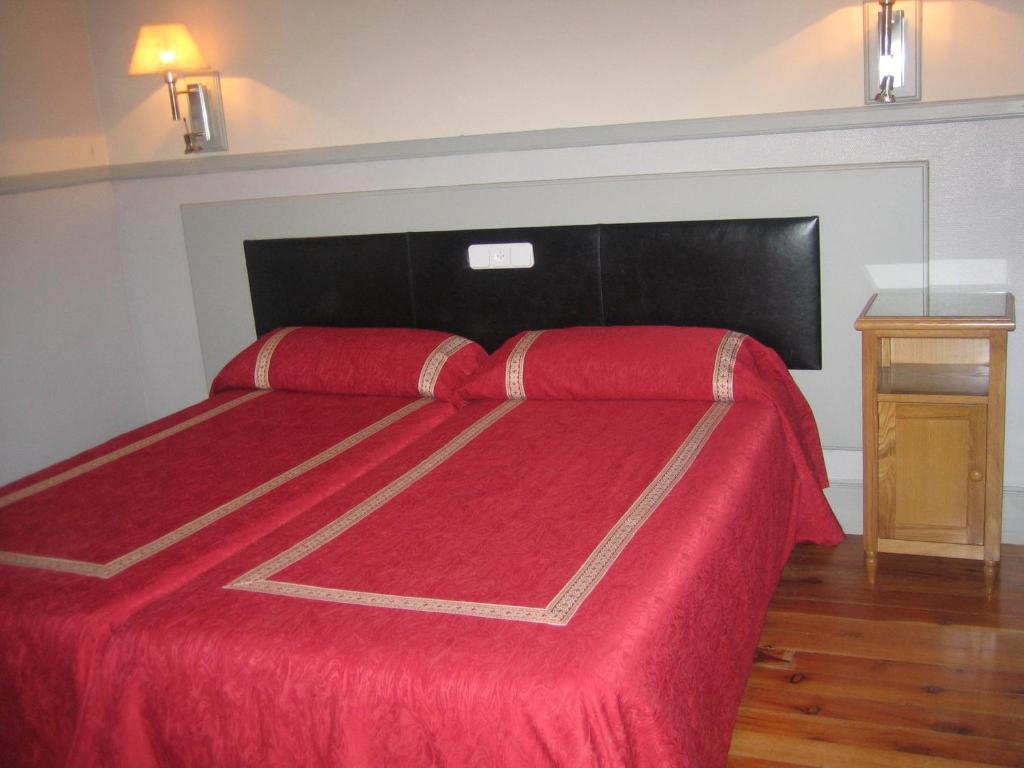 Postel nebo postele na pokoji v ubytování Hostal Canovas