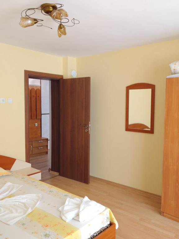 Postel nebo postele na pokoji v ubytování Apart Hotel Hetodon