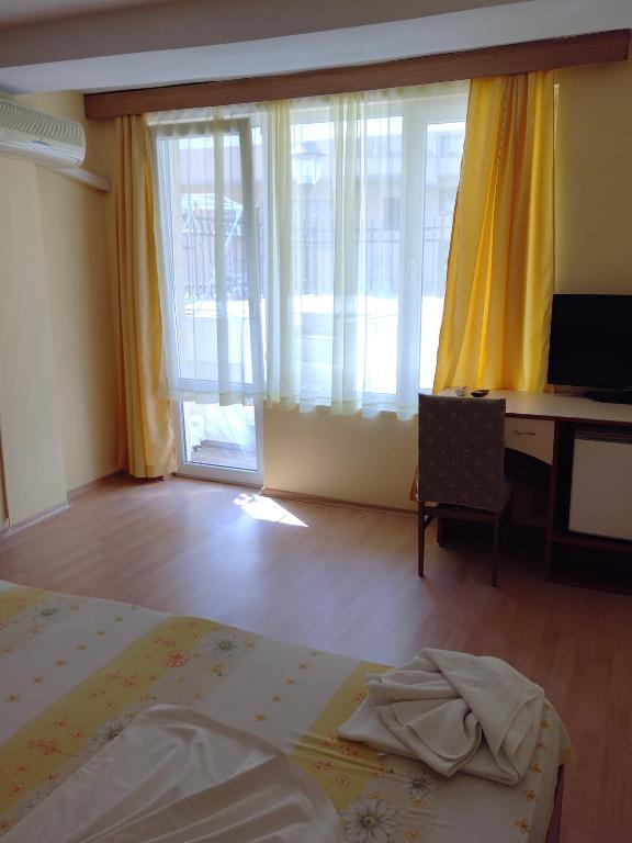 Postel nebo postele na pokoji v ubytování Apart Hotel Hetodon