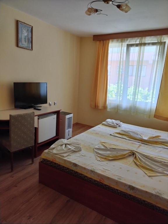 Postel nebo postele na pokoji v ubytování Apart Hotel Hetodon
