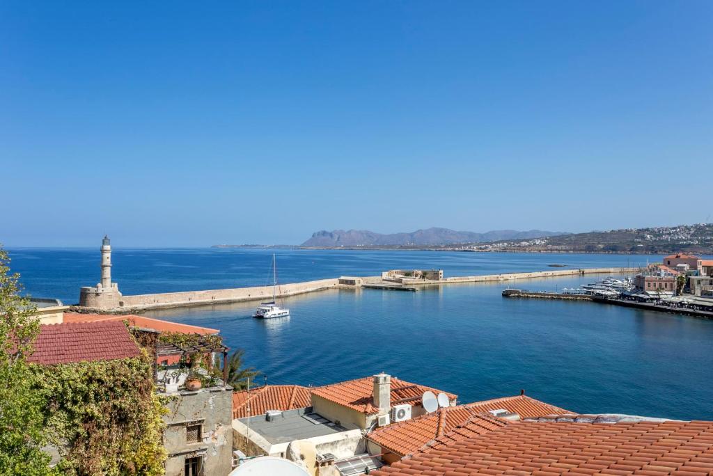 a view of a body of water with a pier at Ifigenia Lux MAISONETTE in oldtown and Villas in theriso vilage 14 km outside of chania in Chania