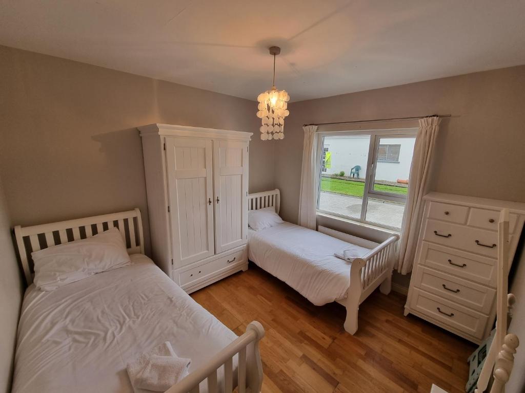 Postel nebo postele na pokoji v ubytování Elemey House