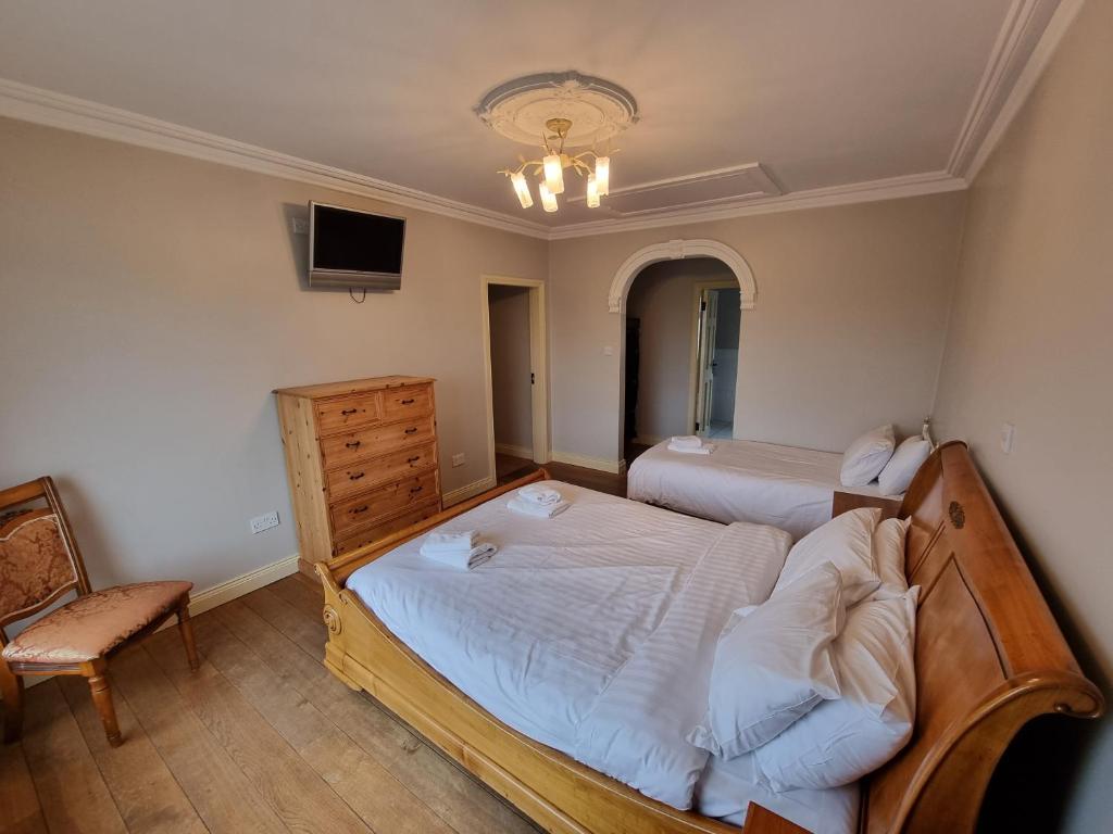 Postel nebo postele na pokoji v ubytování Elemey House