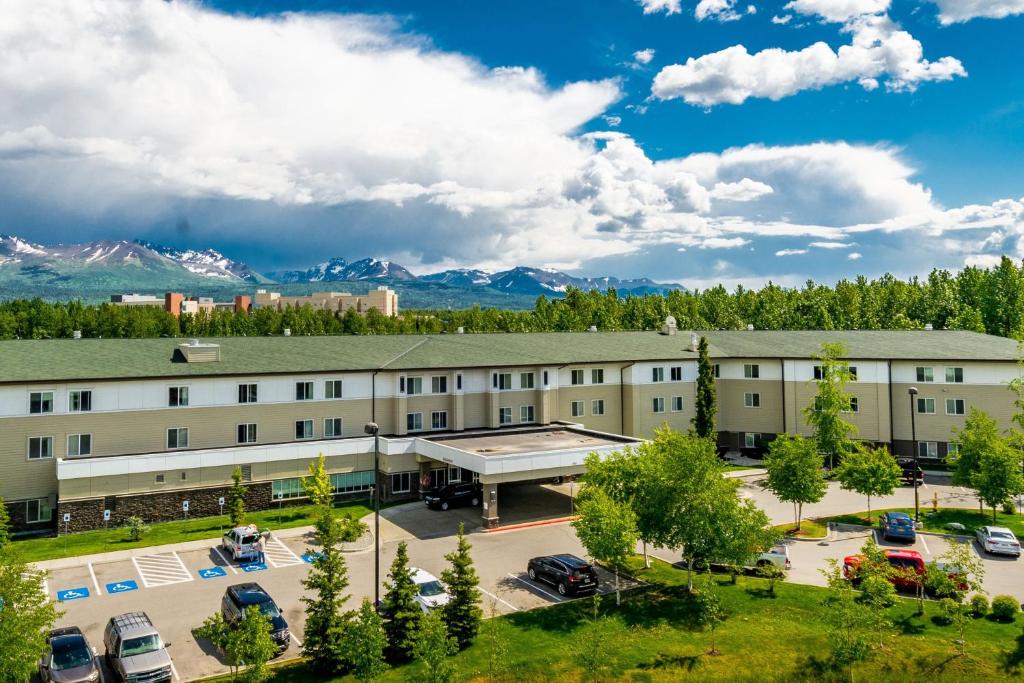 an aerial view of a building with a parking lot at SpringHill Suites Anchorage University Lake in Anchorage
