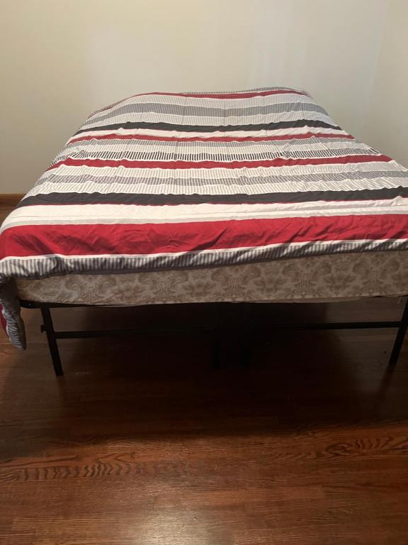 a quilt is sitting on top of a bench at Lake house # 1 in Tacoma
