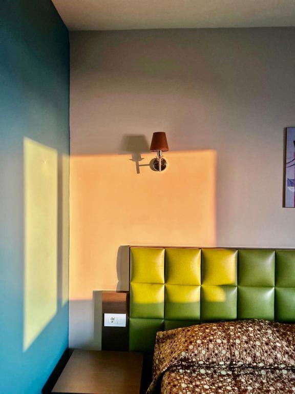 Postel nebo postele na pokoji v ubytování L'Hotel De Mon Pere