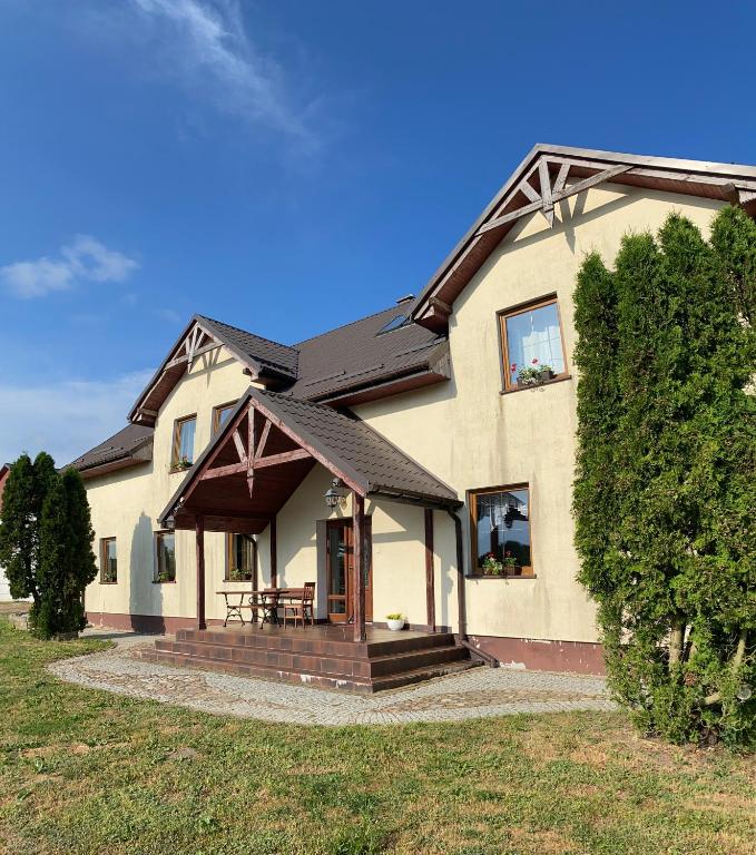 a large house with a porch at Pełnikowe Zacisze in Bobolice