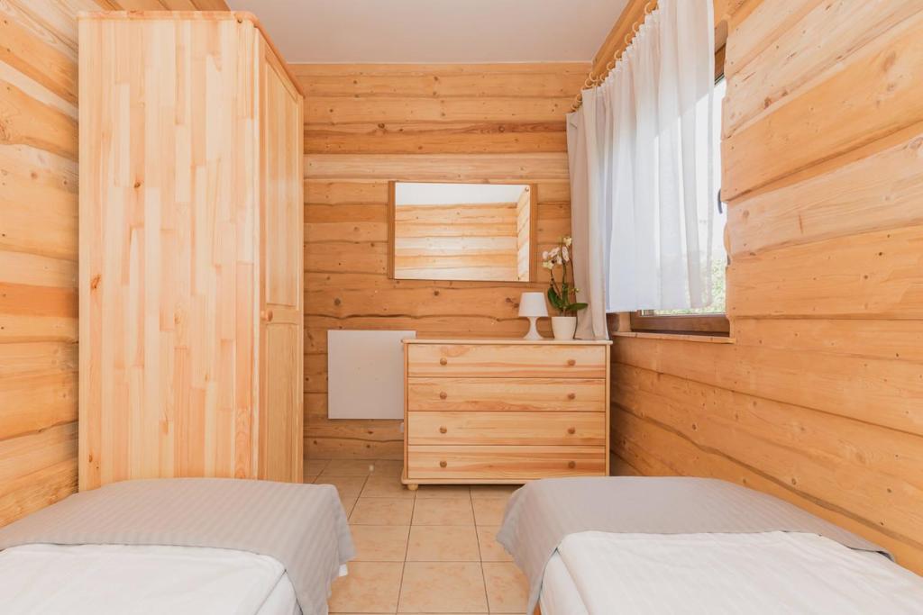 Postel nebo postele na pokoji v ubytování O.W. Laguna