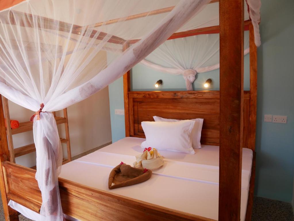 Postel nebo postele na pokoji v ubytování Sabali Lodge, Zanzibar