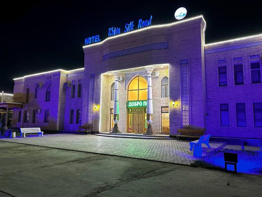 a building with purple lights on the front of it at Khiva Silk Road in Khiva