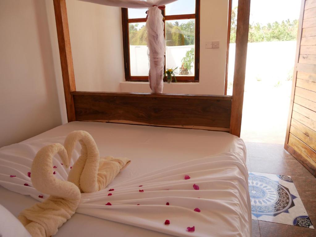 Postel nebo postele na pokoji v ubytování Sabali Lodge, Zanzibar