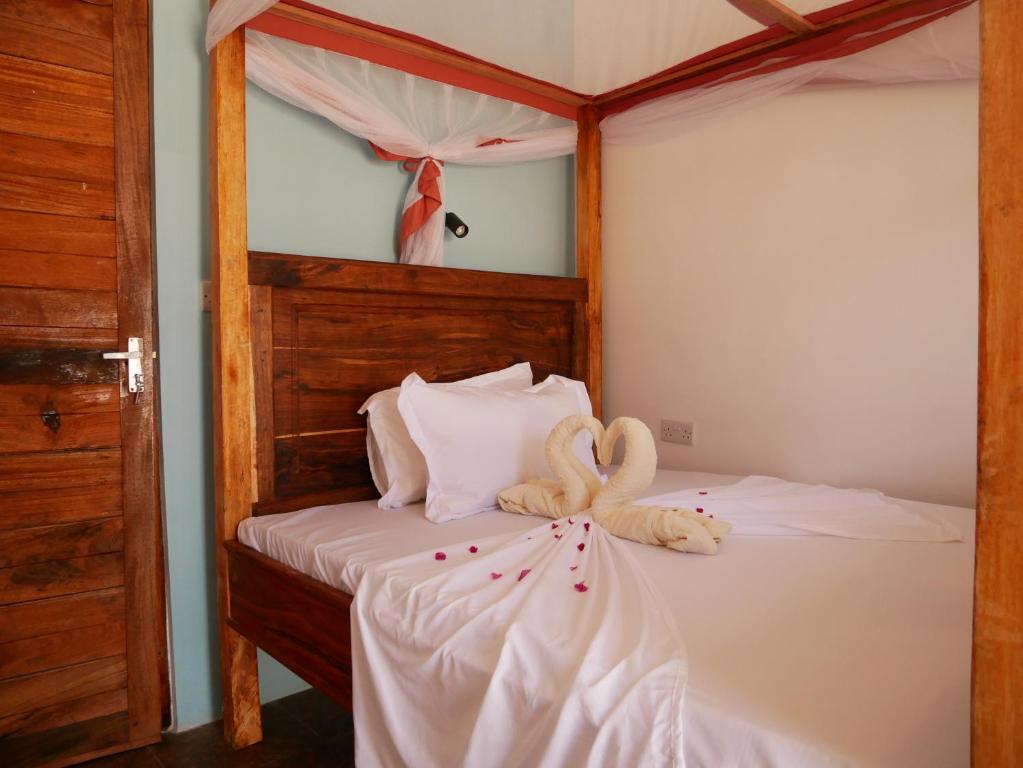 Postel nebo postele na pokoji v ubytování Sabali Lodge, Zanzibar